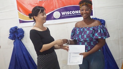 One of the students receiving her award