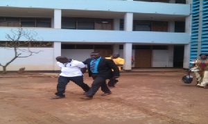 The third suspect, Musa, being whisked away from the court premises
