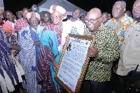 President Akufo-Addo displaying a citation presented to him by Naa Yakubu Abdulai, Sagnari Naa