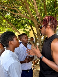 Elliot Dadey interacting with some students