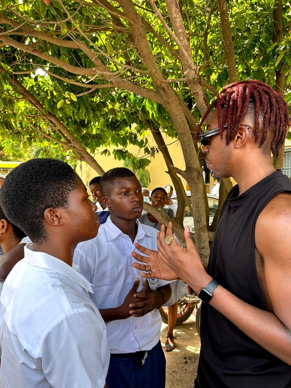 Elliot Dadey interacting with some students