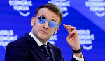 Why is Emmanuel Macron wearing sunglasses indoors at Davos?