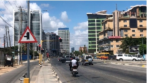 Motorists drive along Bagamoyo Road in Dar es Salaam, Tanzania.