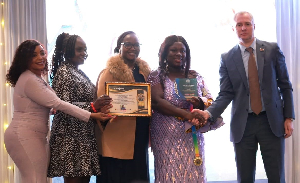 Planner Gifty Nyarko (M) receiving her title