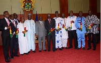 Akufo-Addo, Dr Mahamudu Bawumia in a group photograph with the newly sworn-in Regional Ministers
