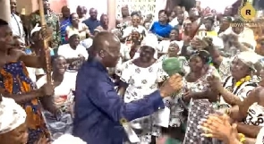 Otumfuo Osei Tutu II dancing with his subject at the Manyhia Palace after his arrival form Trinidad