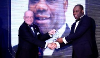 Dr. Matthew Opoku Prempeh, Education Minister receiving his award from US Ambassador Robert Jackson