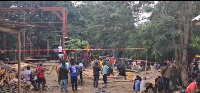 Some people gathered at the collapsed mining site