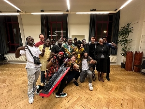 Pat Thomas with his band after their performance in Belgium