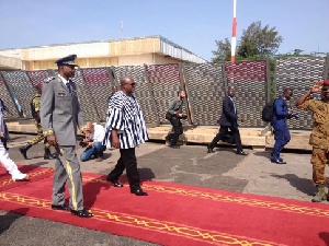 President John Mahama walks with coup leader General Gilbert Diendere in Burkina Faso