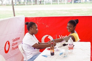 A student getting her vitals checked