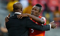 Kwesi Appiah and Asamoah Gyan hugging