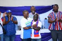 Former and current Fomena constituency chairmen hugging it out with NAPO looking on from behind