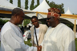 President Mahama in a handshake with Chief Dele Momodu
