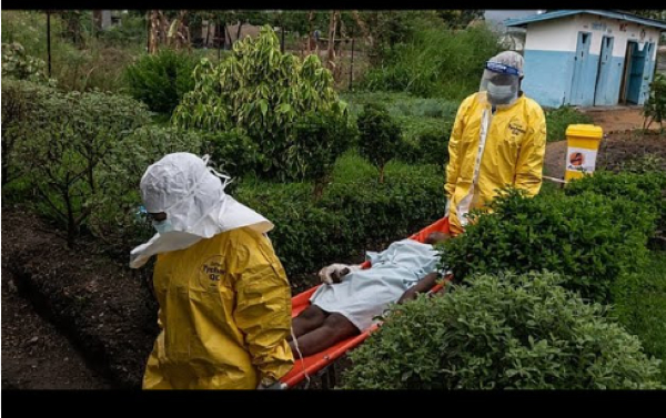 Medical staff carry an Ebola patient to a treatment center in Rwampara, Congo, Thursday, May 21, 202