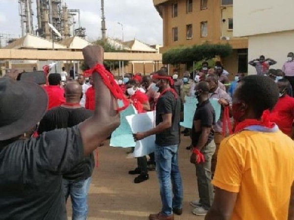 Some of the workers clad in red t-shirts and armbands