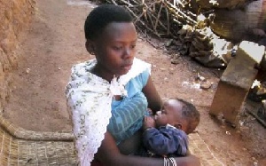 File photo: A teenager holding her baby