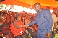 Omanhemaa Nana Yaa Ansua in a handshake with Hon. Samuel Awuku