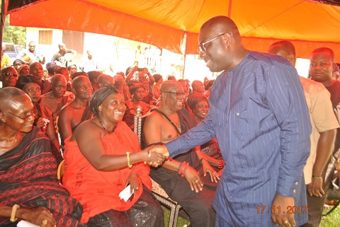 Omanhemaa Nana Yaa Ansua in a handshake with Hon. Samuel Awuku