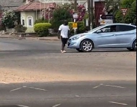 Man knocked down while trying to stop a car