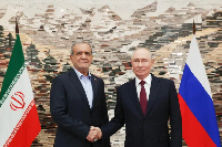 Putin and Pezeshkian shake hands at the SCO summit in Bishkek