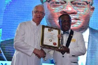 Chief Executive Officer of uniBank, Felix Nyarko-Pong (r) with his award