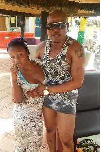 Bukom Banku seen fondling the breasts of two young ladies