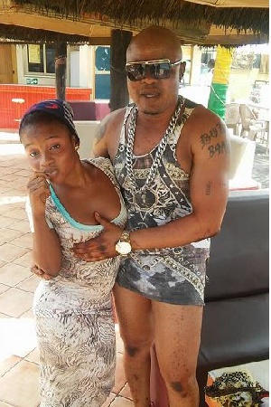 Bukom Banku seen fondling the breasts of two young ladies