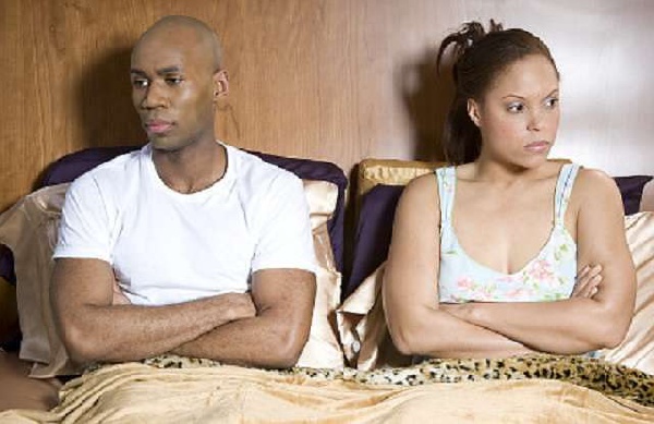 Unhappy couple in bed (file photo)