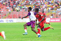 Players of Asante Kotoko and Hearts of Oak during the game