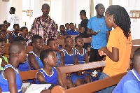 Members of the foundation educating some pupils of Peki Blengo