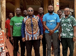 Dr Bampoe (L) in a pose with staff at the office