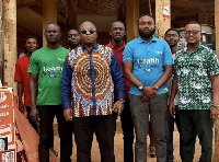 Dr Bampoe (L) in a pose with staff at the office