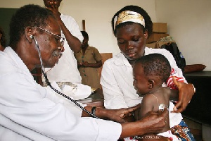 A doctor examining a child