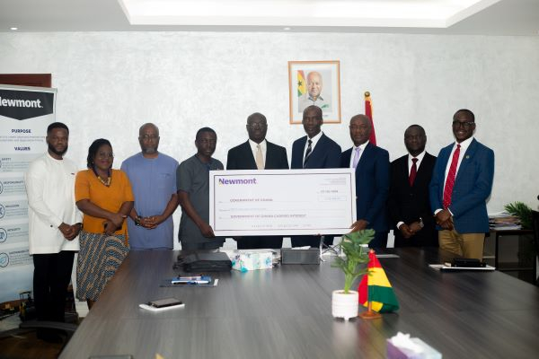 Newmont representatives present cheque to Finance Minister, Ato Forson