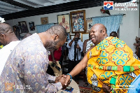 Konor of Manya Krobo, Nene Sakite II in a handshake with NAPO