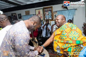 Konor of Manya Krobo, Nene Sakite II in a handshake with NAPO