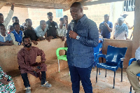 Emmanuel Armah-Kofi Buah engaging with some community members