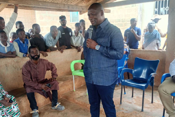 Emmanuel Armah-Kofi Buah engaging with some community members