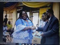 Mr. Kwadwo Asare-Bediako presenting a certificate to Mrs. Audrey Sasu Appiah