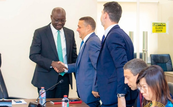 Minister of Finance, Dr Cassiel Ato Forson in a handshake with head of IMF Mission Ruben Atoyan