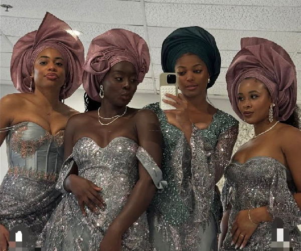 Gabby Thomas (in a green scarf) was spotted at a friend's wedding