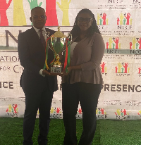 Clerk to Parliament Ebenezer Djietror and NCCE Chairperson Kathleen Addy