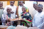 Naana Jane Opoku-Agyemang presenting the donated items to some Muslim elders