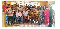 Participants pose for a photo after the meeting