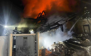 Emergency responders attend a scene of a Russian drone attack on a home in Bohodukhiv