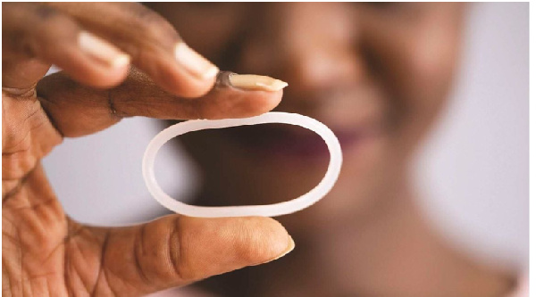 A woman holds a diaphragm of a vaginal contraceptive ring