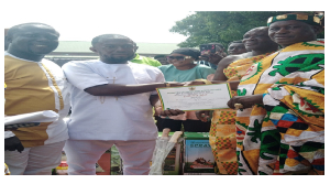 Adam Musah Atebubu-Amantin municipal overall best farmer receiving his certificate