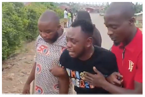 Brother of the late MP Ernest Kumi being consoled after breaking down in tears