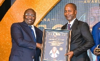 Vice President Dr Mahamudu Bawumia [L] presenting the award to Dr. Nick Danso Adjei [L]